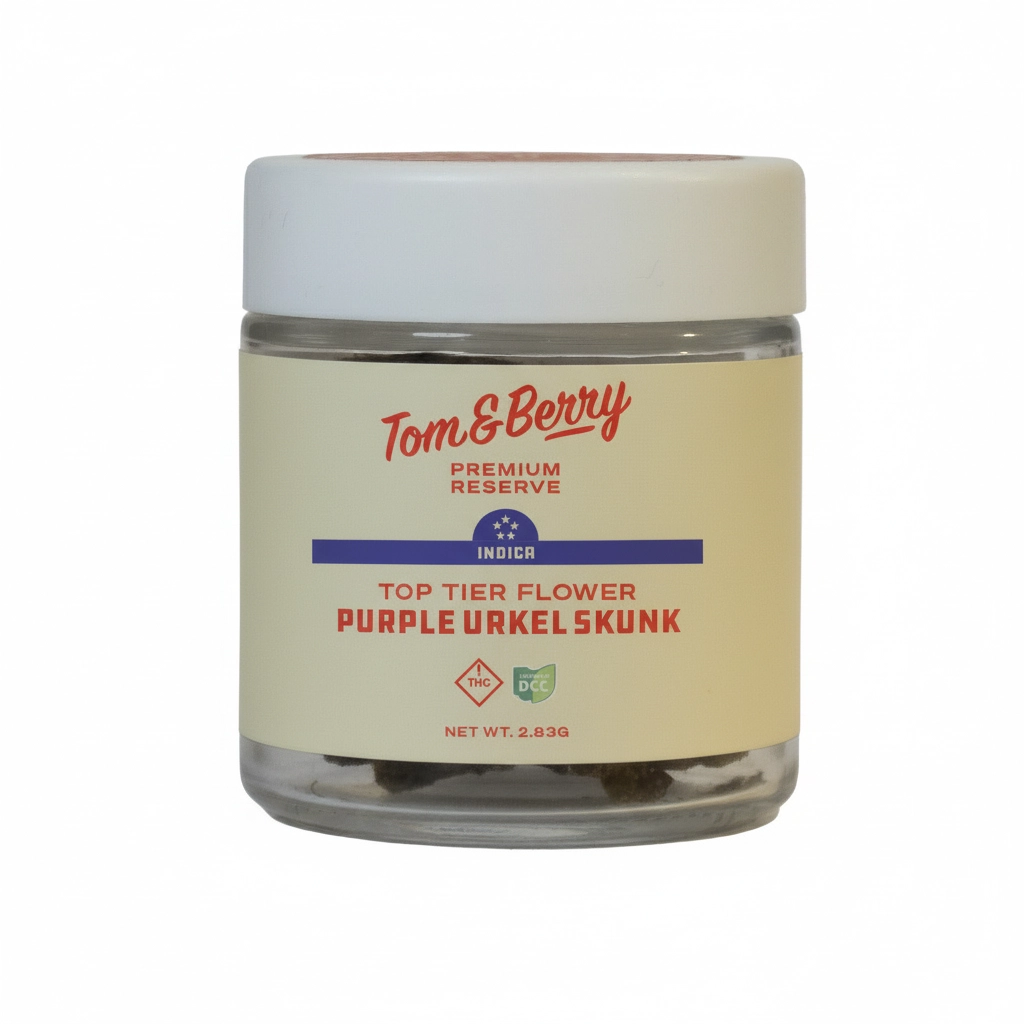 Purple Urkel Skunk flower in a Tom & Berry Premium Reserve glass jar with a cream and red label